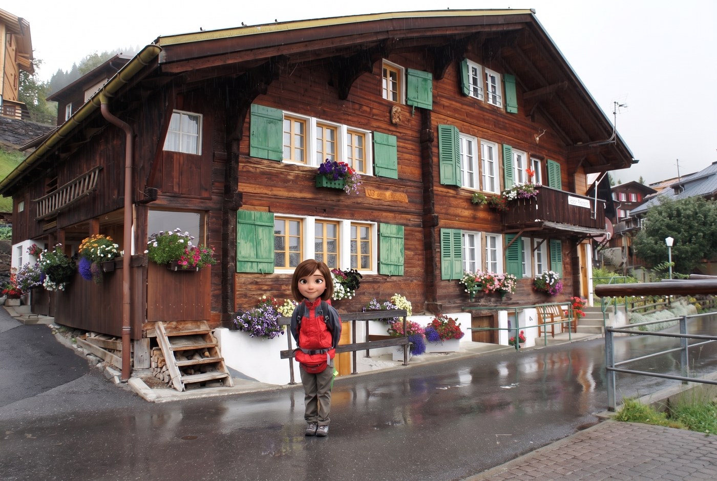 崖の上の村ミューレン(Mürren)に到着。緑の鎧戸と、窓辺いっぱいの花で飾られた伝統的な木造シャレーの前で記念撮影。あいにくの雨で石畳は濡